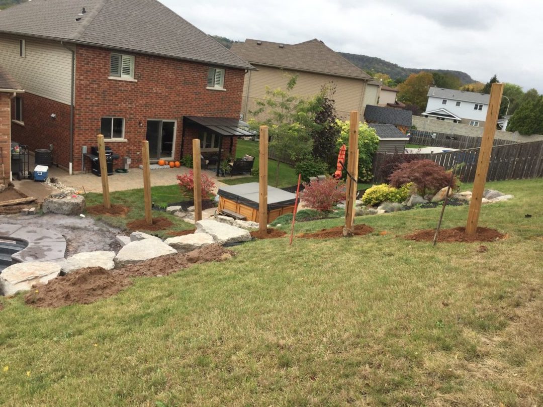Drilling backyard fence posts in new subdivision